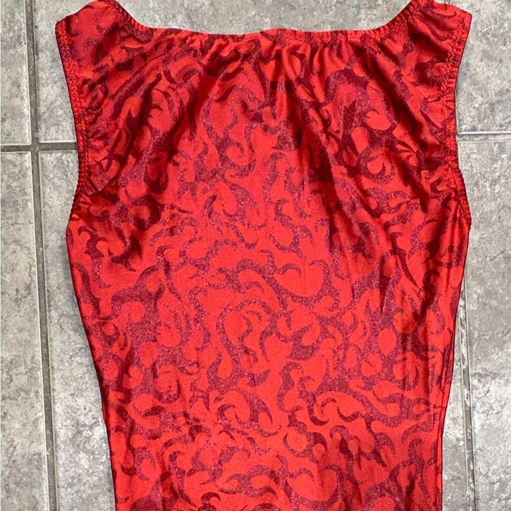 Red one piece leotard size small 
with sparkly flames detail